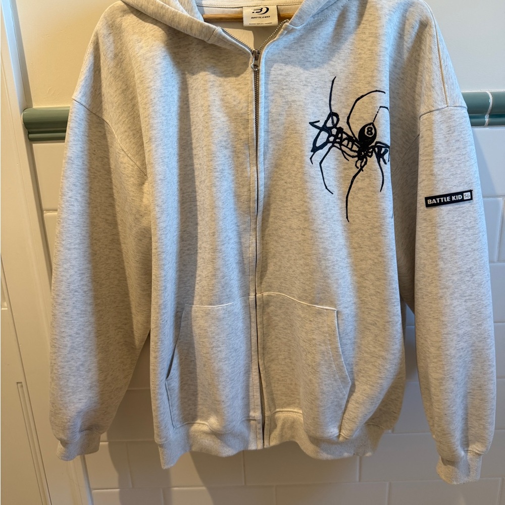 Light Gray Zip Hoodie with Black Spider Graphic